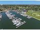 Aerial view of a marina featuring boat docks and a yacht club with a swimming pool at 6113 Kipps Colony W Dr, Gulfport, FL 33707