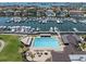 Luxury marina showcasing a swimming pool, grilling station, and yacht docking facilities at 6113 Kipps Colony W Dr, Gulfport, FL 33707