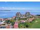 Stunning aerial view of condos and townhomes with a golf course along Tampa Bay at 6322 Palma Del Mar S Blvd # 706, St Petersburg, FL 33715