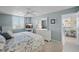 Comfortable bedroom with ensuite bathroom access, shuttered windows, and television at 6322 Palma Del Mar S Blvd # 706, St Petersburg, FL 33715