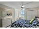 Bedroom featuring a patterned bed, a window with a view, a dresser and a ceiling fan at 6322 Palma Del Mar S Blvd # 706, St Petersburg, FL 33715