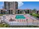 Exterior view of the spacious community pool area with tables and chairs for residents at 6322 Palma Del Mar S Blvd # 706, St Petersburg, FL 33715