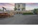 Beautiful condo building exterior with lush landscaping and convenient covered parking at 6322 Palma Del Mar S Blvd # 706, St Petersburg, FL 33715