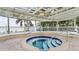 Inviting community hot tub in a serene, shaded area, ideal for relaxation and leisure at 6322 Palma Del Mar S Blvd # 706, St Petersburg, FL 33715