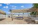 Community hot tub featuring a shaded pergola, offering a relaxing space with views of the water at 6322 Palma Del Mar S Blvd # 706, St Petersburg, FL 33715