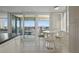 Bright breakfast nook area offers panoramic water views and seating for enjoying meals at 6322 Palma Del Mar S Blvd # 706, St Petersburg, FL 33715