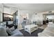 Bright living room boasts modern furnishings, dining area, and balcony access with natural light at 6322 Palma Del Mar S Blvd # 706, St Petersburg, FL 33715