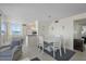 Inviting living space with tile flooring, a dining area, and a view of the modern kitchen at 6322 Palma Del Mar S Blvd # 706, St Petersburg, FL 33715