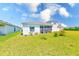Lush backyard with a well-maintained lawn, and patio for relaxation at 6333 Milestone Loop, Palmetto, FL 34221