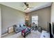Neutral-toned bedroom featuring a workspace and cozy seating at 6333 Milestone Loop, Palmetto, FL 34221