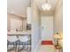 Inviting entryway featuring neutral tones, ceramic tile, and modern lighting that seamlessly connects the kitchen and living areas at 6333 Milestone Loop, Palmetto, FL 34221
