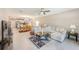 Open floor plan showcasing the living room, dining area, and kitchen with modern appliances at 6333 Milestone Loop, Palmetto, FL 34221
