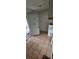 Functional laundry room featuring tile flooring and a water heater at 702 Whitehurst Rd, Plant City, FL 33563