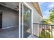 Step onto the balcony from the living area, offering neighborhood views and a space for outdoor relaxation at 7070 Opal Dr, Largo, FL 33773
