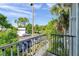 Enjoy the view of the community parking area and palm trees from this peaceful balcony spot at 7070 Opal Dr, Largo, FL 33773