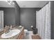 Bathroom with granite countertop vanity, updated mirror and new toilet at 7070 Opal Dr, Largo, FL 33773