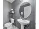 Cozy half bathroom with a stylish sink and neutral paint at 7070 Opal Dr, Largo, FL 33773