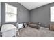 Well-lit bedroom offering a serene space with a comfortable couch and a stylish writing desk at 7070 Opal Dr, Largo, FL 33773