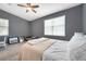 Cozy bedroom featuring natural light, modern furniture, and views of the exterior at 7070 Opal Dr, Largo, FL 33773