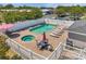 Enjoy the view of the community pool and jacuzzi, surrounded by seating and meticulously maintained grounds at 7070 Opal Dr, Largo, FL 33773