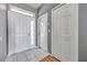 Bright entryway with white doors, tile floor, and natural light at 7070 Opal Dr, Largo, FL 33773