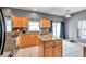 Kitchen features granite countertops, stainless steel appliances, island, and sliding doors at 7070 Opal Dr, Largo, FL 33773