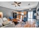 Open concept with living room, kitchen, and hardwood floors at 7070 Opal Dr, Largo, FL 33773