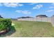 Expansive backyard featuring lush green grass and a privacy fence, perfect for outdoor activities and relaxation at 7236 Salt River Ave, Sun City Center, FL 33573