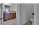 Spacious bathroom featuring a double vanity with granite countertop and a separate toilet area at 7236 Salt River Ave, Sun City Center, FL 33573