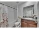 Bathroom featuring a shower and tub combo, granite countertops, and a decorative vase at 7236 Salt River Ave, Sun City Center, FL 33573