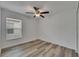 Bedroom featuring hardwood floors, a modern ceiling fan, and a bright window for natural lighting at 7236 Salt River Ave, Sun City Center, FL 33573