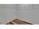 Walk-in closet with wire shelving and laminate flooring, offering ample storage space at 7236 Salt River Ave, Sun City Center, FL 33573