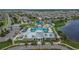 Aerial shot of a community center and pool surrounded by lush landscaping at 7236 Salt River Ave, Sun City Center, FL 33573