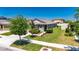 Landscaped yard with lush green lawn surrounding a charming single-story home featuring delightful curb appeal at 7236 Salt River Ave, Sun City Center, FL 33573