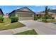 Charming home featuring a spacious driveway and well-maintained landscaping, enhancing curb appeal at 7236 Salt River Ave, Sun City Center, FL 33573