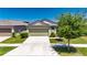 Charming single-story home with a well-manicured lawn, two car garage, and welcoming curb appeal at 7236 Salt River Ave, Sun City Center, FL 33573