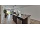Open-concept kitchen featuring a large island, stainless steel dishwasher, and seamless access to the living area at 7236 Salt River Ave, Sun City Center, FL 33573