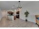 Open concept kitchen with a center island, granite countertops, tile flooring, and stainless steel appliances at 7236 Salt River Ave, Sun City Center, FL 33573