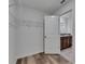 Spacious walk-in closet with wire shelving and a view to the bathroom with granite countertops at 7236 Salt River Ave, Sun City Center, FL 33573