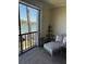 Cozy screened in lanai with a chair and corner table looking out over the intercoastal waterway at 7465 Bay Island S Dr # 211, South Pasadena, FL 33707