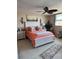 Cozy bedroom with a comfortable bed, decorative pillows, and a view from the window at 7465 Bay Island S Dr # 211, South Pasadena, FL 33707