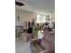 Spacious living area boasts comfortable seating, a dining area, and natural light, ideal for relaxation at 7465 Bay Island S Dr # 211, South Pasadena, FL 33707