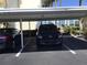 Covered parking spot with vehicle at 7465 Bay Island S Dr # 211, South Pasadena, FL 33707