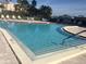 Community pool with lounge seating and well-maintained surroundings for relaxation and recreation at 7465 Bay Island S Dr # 211, South Pasadena, FL 33707
