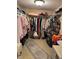 Well-organized walk-in closet with ample hanging space and storage shelves at 7465 Bay Island S Dr # 211, South Pasadena, FL 33707
