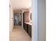 Modern bathroom with walk-in glass shower, modern vanity with accent lighting, and storage at 777 3Rd N Ave # 1308, St Petersburg, FL 33701