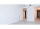 Neutral bedroom features grey tile flooring and leads to the ensuite and the washer/dryer area at 777 3Rd N Ave # 1308, St Petersburg, FL 33701