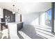 Open-concept kitchen and living area featuring tile floors, stainless appliances, and natural light at 777 3Rd N Ave # 1308, St Petersburg, FL 33701