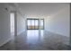 Spacious living room with large windows and marble floors, offering panoramic city views with sleek interiors at 777 3Rd N Ave # 1501, St Petersburg, FL 33701