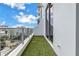 Balcony of condo features an outdoor grassy area with views of city buildings in the distance at 777 3Rd N Ave # 707, St Petersburg, FL 33701